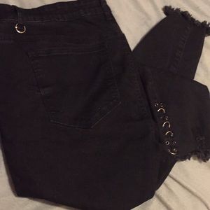 Black jeans with rings on them, size 18. Rue21.